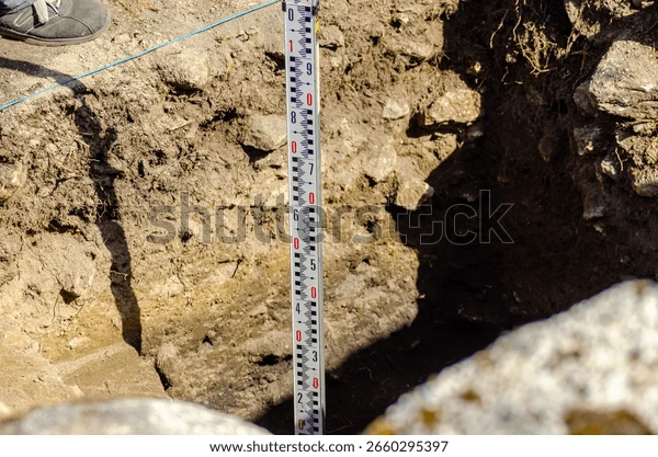 A geologist reviewing satellite terrain analysis on a field tablet